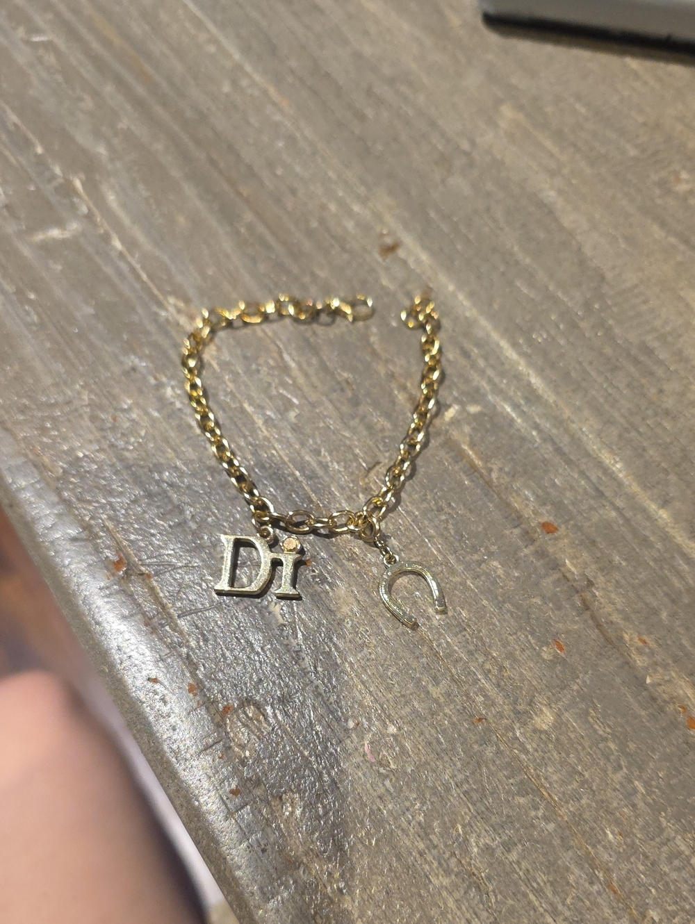 Gold Tone 'Dior' Charm Chain Bracelet with Horseshoe Accent
